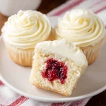 Almond Wedding Cake Cupcakes with Raspberry Filling